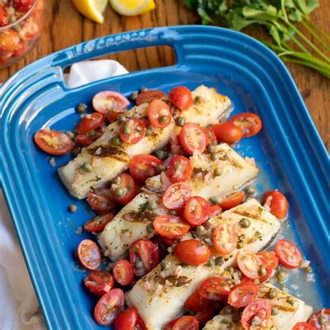 sea-bass-fish-with-tomatoes-in-a-lemon-butter-sauce image