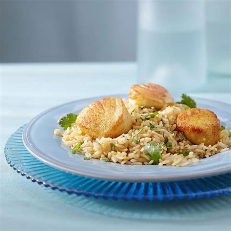 curry-scallops-cilantro-rice-recipe-eatingwell image