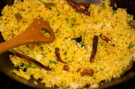 indian-yellow-fried-rice-with-peas-tasty-kitchen image