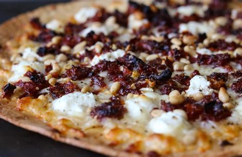 goat-cheese-pizza-with-sun-dried-tomatoes-pine-nuts image