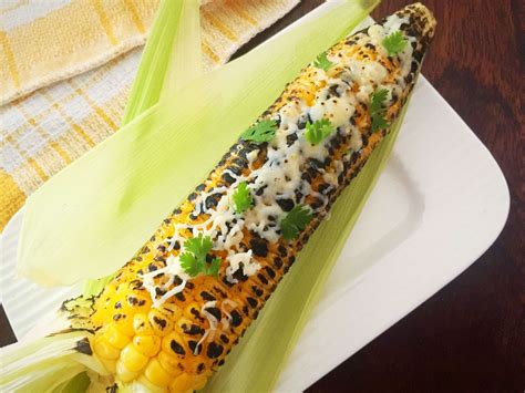 cheesy-corn-on-the-cob-recipe-archanas-kitchen image