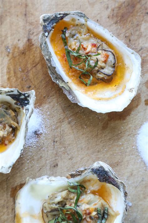 grilled-oysters-with-chipotle-bourbon-butter image