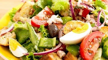 baby-spinach-caesar-salad-with-olive-bread-croutons image
