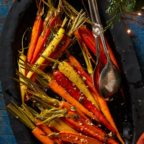 maple-thyme-roasted-baby-carrots-recipe-eatingwell image