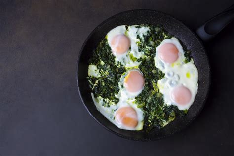skillet-baked-eggs-with-spinach-yogurt-and-chili-oil image