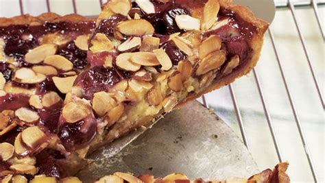 cherry-custard-tart-with-sliced-almonds-finecooking image