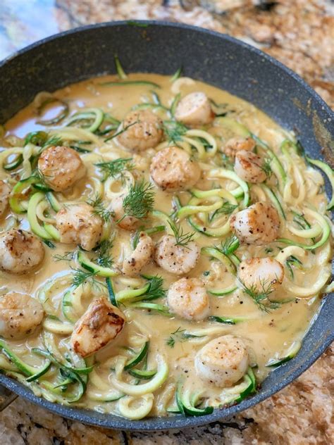 scallops-in-creamy-garlic-sauce-with-zoodles-colorful image