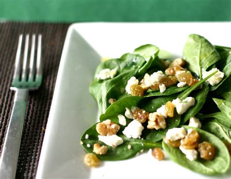 spinach-salad-with-cheese-walnuts-and-raisins-az image