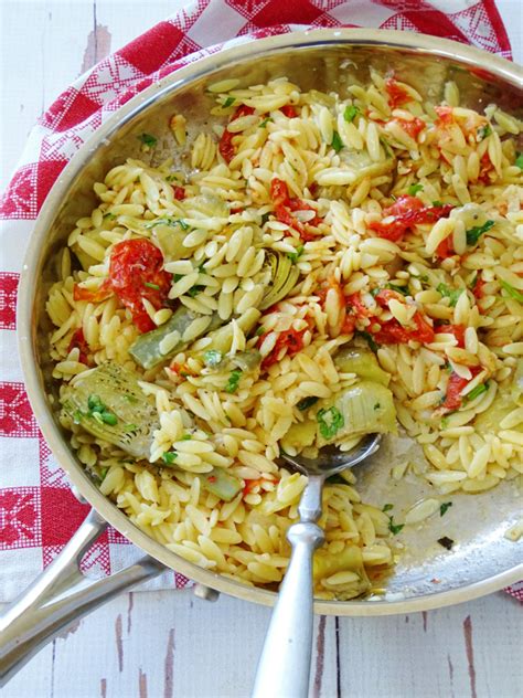 orzo-pasta-with-artichoke-hearts-and-roasted-tomatoes image