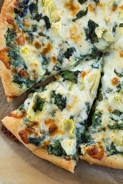 homemade-artichoke-pizza-with-spinach-cooking image