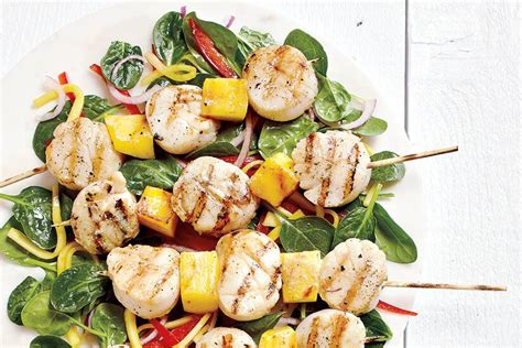 mango-scallop-skewers-with-spinach-toss-canadian-living image