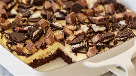 kit-kat-and-oreo-cheesecake-brownie-bars image