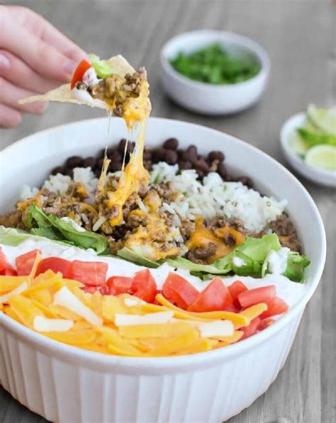7-layer-taco-dip-with-lime-cilantro-rice-a-helicopter image
