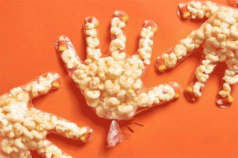 halloween-popcorn-mummy-hands-kitchn image
