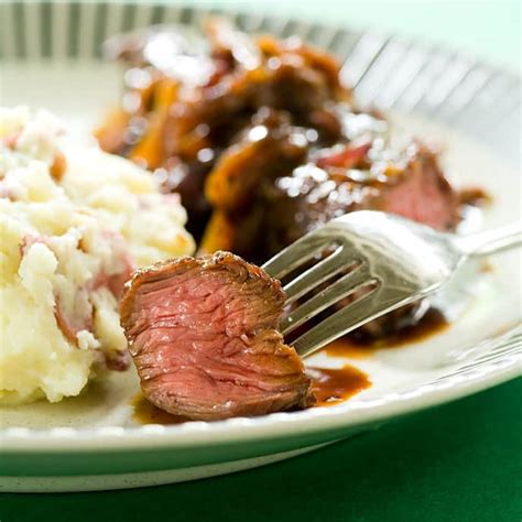 skillet-smothered-steak-tips-americas-test-kitchen image