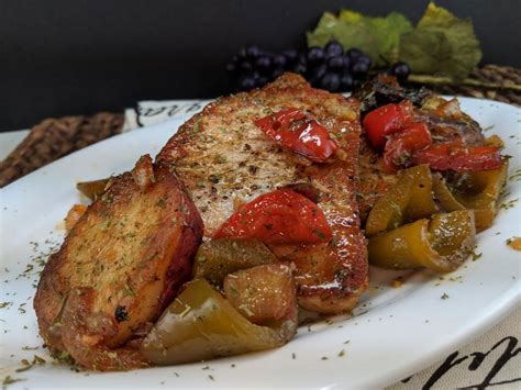 pork-chops-with-peppers-onions-and-potatoes image