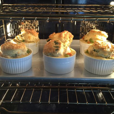 mini-chicken-pot-pies-with-herb-and-cheese-biscuit image