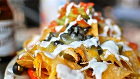 how-to-build-the-perfect-plate-of-nachos-huffpost-life image