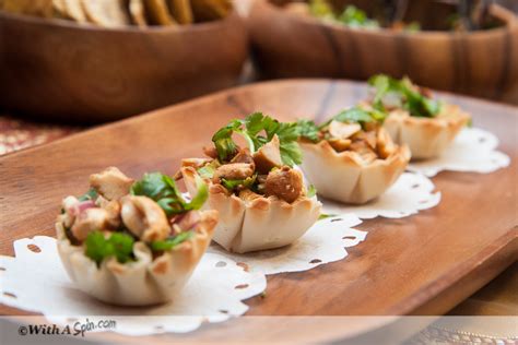 nutty-chicken-salad-shells-appetizer-recipe-withaspin image