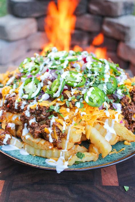 loaded-chili-cheese-fries-over-the-fire-cooking image