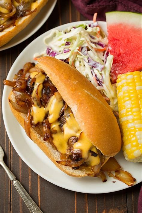 brats-with-caramelized-onions-and-cheddar-cheese-sauce image