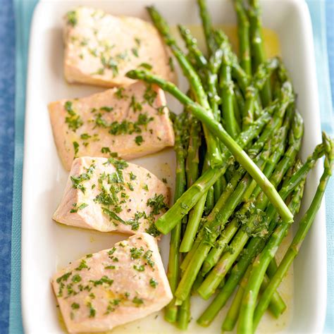 citrus-poached-salmon-with-asparagus-eatingwell image