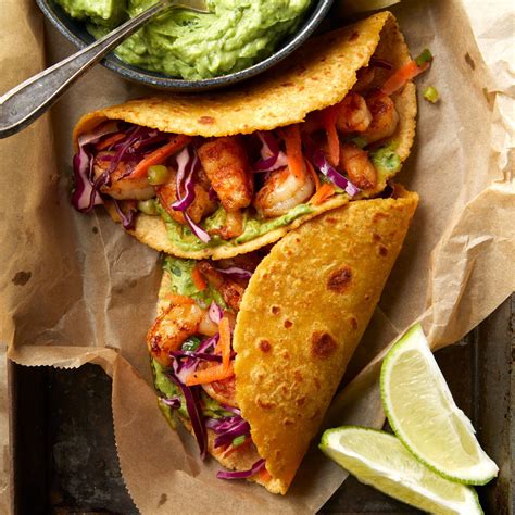 shrimp-tacos-with-avocado-crema-recipe-eatingwell image