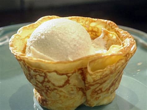 crepes-suzette-with-vanilla-ice-cream-and-orange-butter image