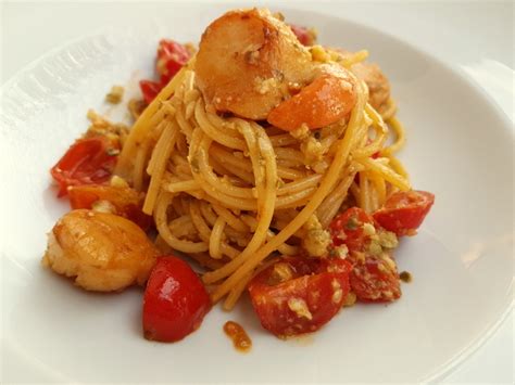 spaghetti-with-scallops-and-citrus-fruit-italian image
