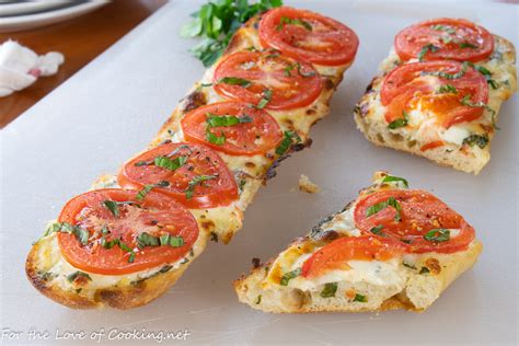 open-faced-tomato-and-mozzarella-sandwich-with-basil image
