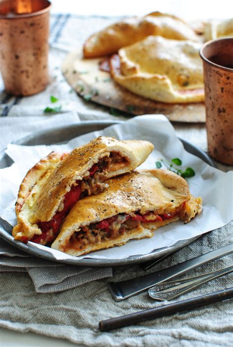italian-sausage-and-roasted-red-pepper-calzones-bev image