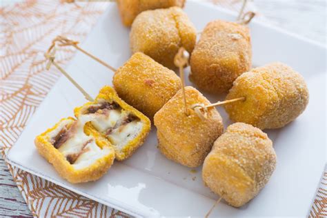 fried-mozzarella-and-anchovy-skewers-giallozafferano image