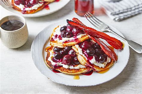 fluffy-pancakes-with-berry-cherry-syrup-better-homes image