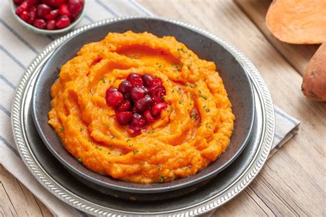 mashed-sweet-potatoes-with-orange-juice-and-cranberries image