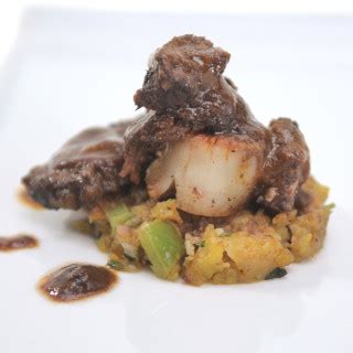 braised-short-ribs-with-seared-scallop-on-mofongo image