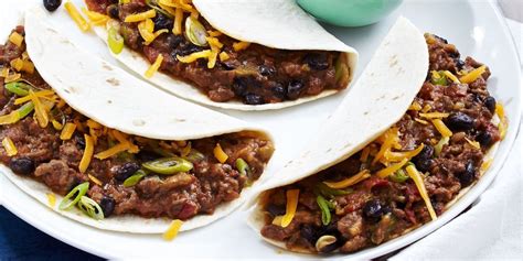 how-to-make-cheesy-ground-beef-tacos-delish image