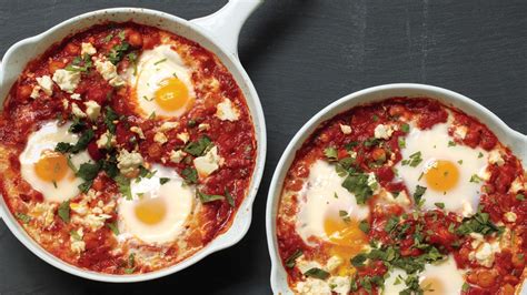 poached-eggs-in-tomato-sauce-with-chickpeas-and-feta image