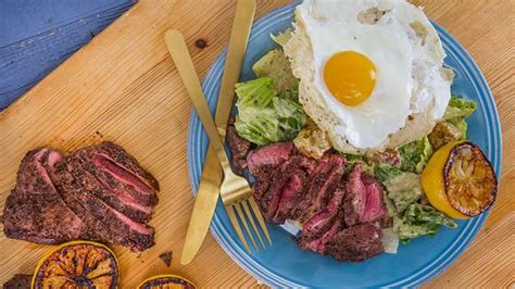rachaels-caesar-salad-with-sliced-steak-and-frico-egg image