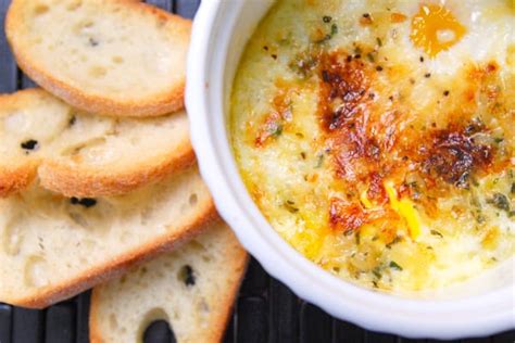 parmesan-baked-eggs-recipe-with-thyme-and-rosemary image
