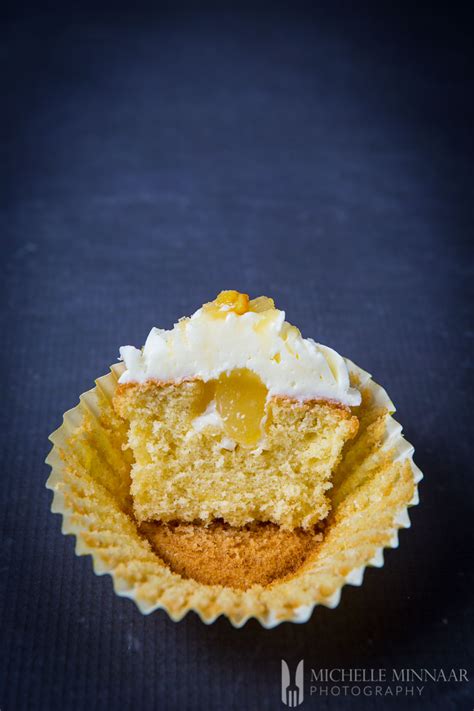 drizzled-lemon-curd-cupcakes-food-travel-blog image