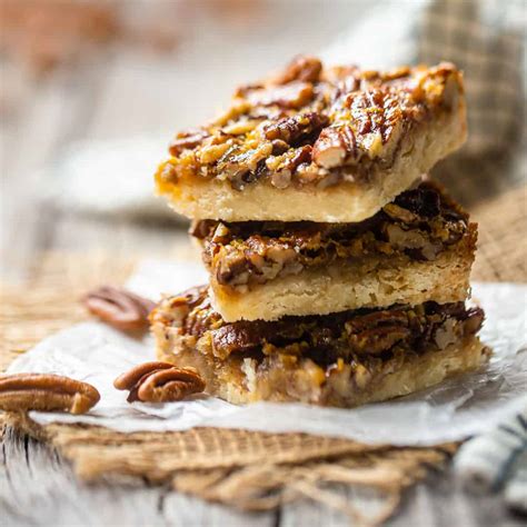 pecan-pie-bars-gooey-nutty-filling-over-a-buttery-crust image