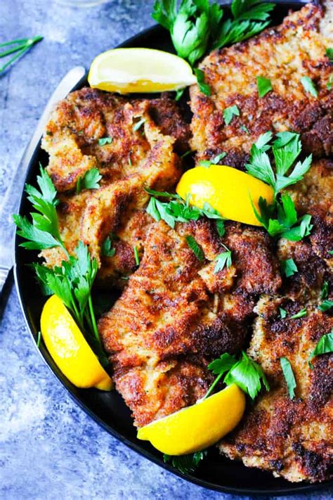 veal-milanese-italian-breaded-veal-cutlets-eating image
