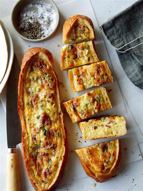 baked-egg-boats-breakfast-recipe-spoon-fork-bacon image
