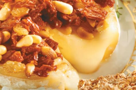 baked-camembert-with-pine-nuts-sun-dried-tomatoes image