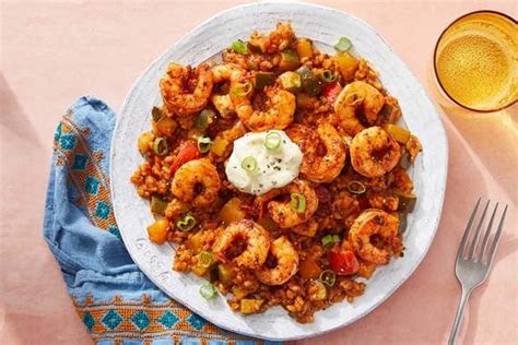 spanish-shrimp-rice-with-vegetables-aioli-blue image