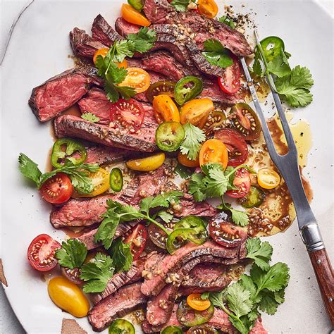 grilled-flank-steak-with-tomato-salad-eatingwell image