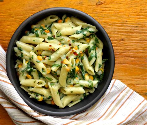 spinach-corn-pasta-recipe-in-creamy-white-sauce image