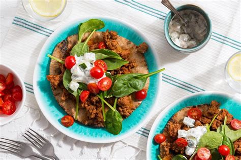 easy-lamb-gyros-with-tomatoes-and-cucumber-tzatziki image