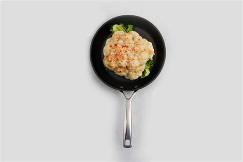 baked-cauliflower-with-cheese-sauce-le-creuset image