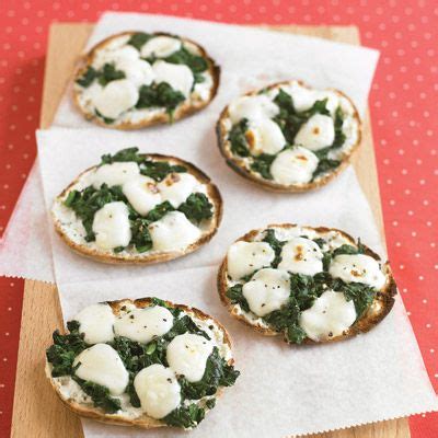 mini-spinach-and-cheese-pizzas-recipe-delish image